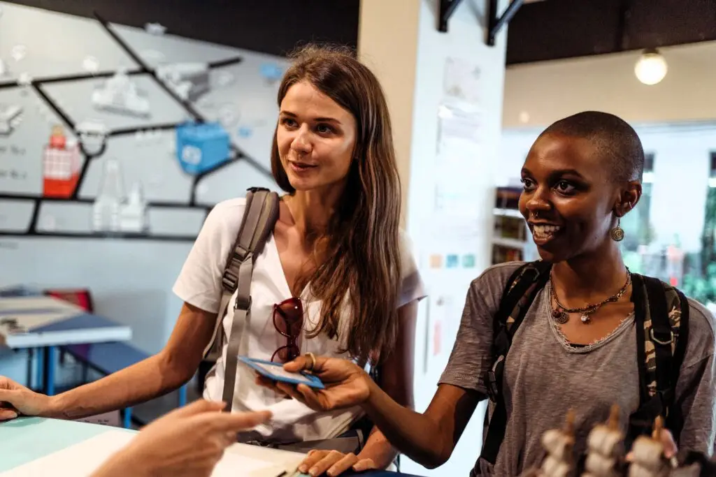 Travellers checking in at a hotel featured in dummy hotel booking